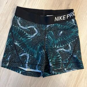 Nike Pro Women’s Teal and Black Patterned Shorts. Size XS